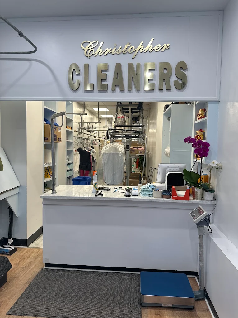 Inside Christopher Cleaners — the service counter and garment carousel